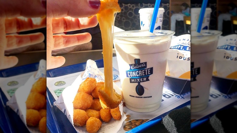 Person taking Culver's cheese curd with cheese pull alongside a Concrete Mixer