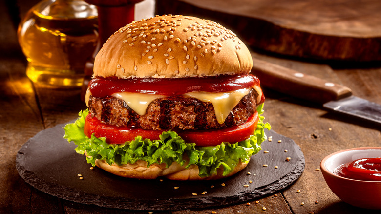 Grilled burger on slate plate