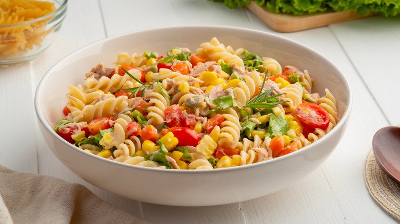 A bowl of tuna pasta on a table.