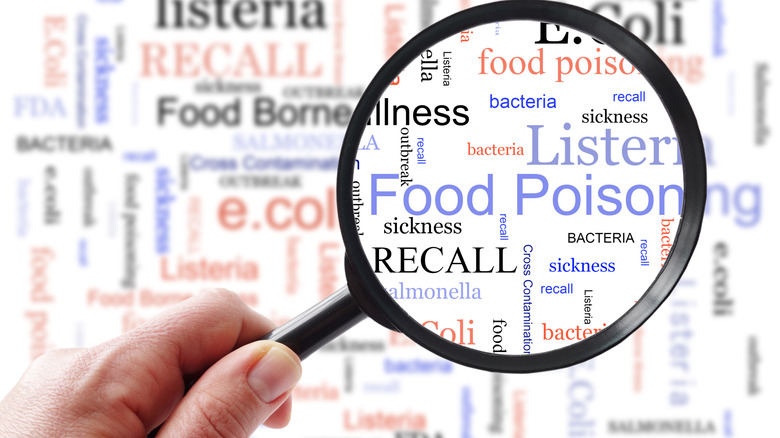 Magnifying glass highlighting all the things that go wrong when there is a dangerous food recall