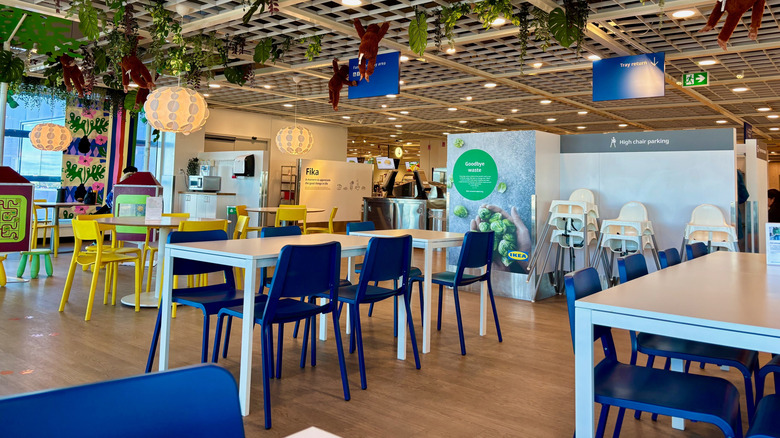 Dining tables and chairs inside an IKEA food court