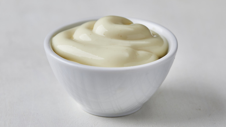 A small white bowl of mayonnaise