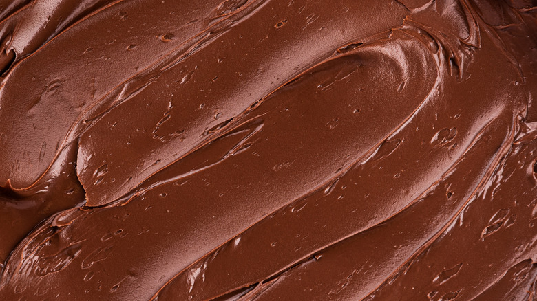 Swirl marks in a close-up of chocolate ganache