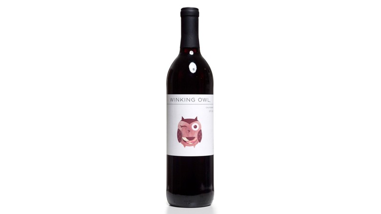 Bottle of Aldi Winking Owl shiraz on white background
