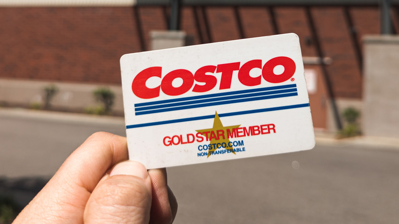 Holding a Costco membership card outside the store
