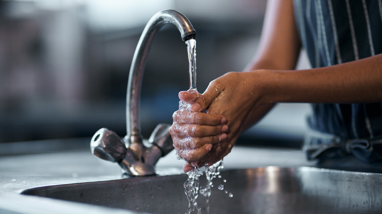 Person washing their hands