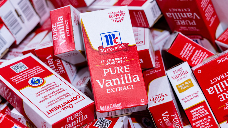 A box of McCormick Pure Vanilla Extract on top of numerous other boxes