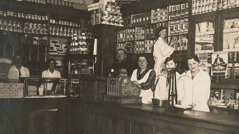 Workers posing at a 1930 Albrecht-owned grocery story