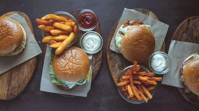 Top view of assorted burgers and fries