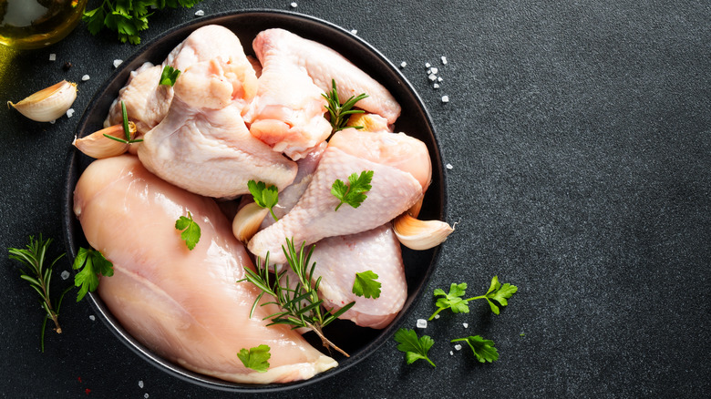 Raw chicken with herbs