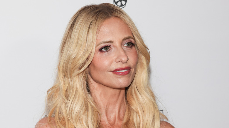 Sarah Michelle Gellar smiles against white backdrop