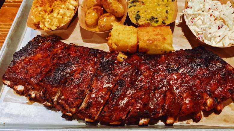 A classic barbecue spread involving ribs and cornbread.