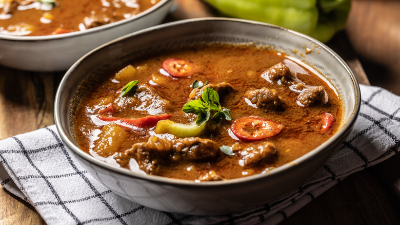 Beef goulash soup in a shallow bowl
