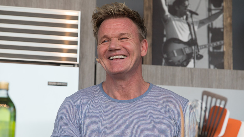 Gordon Ramsay laughing on a TV set