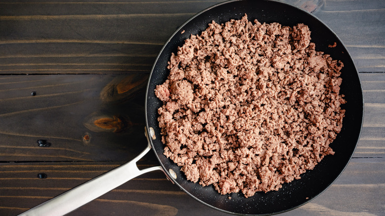 cooked ground beef in a pan