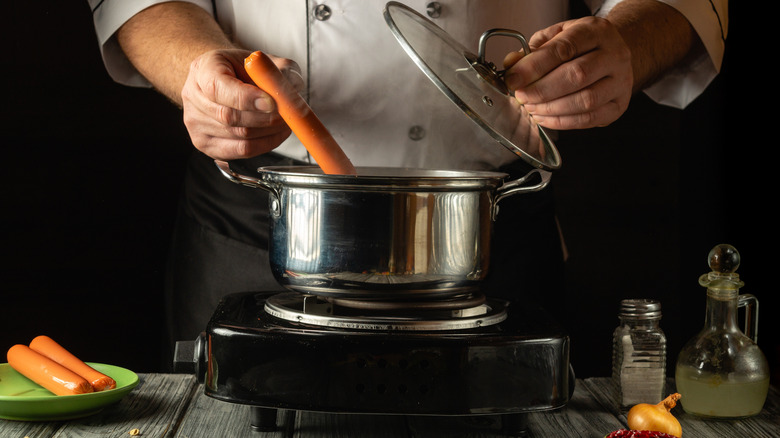 Chef about to boil sausage