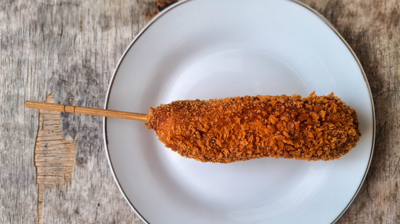 Deep-fried sausage on a plate