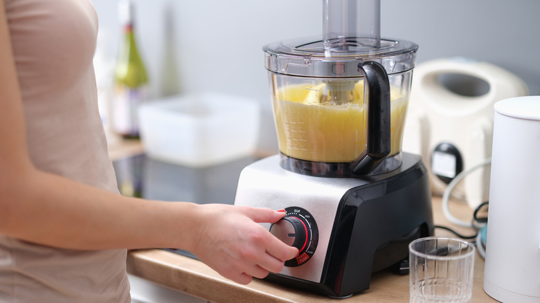 Person using a food processor