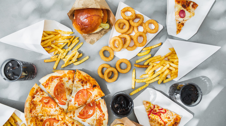 Burgers, fries, pizza, onion rings, and soda