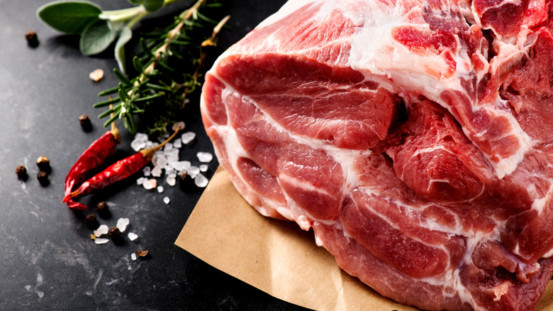 A raw pork filet sitting on a counter