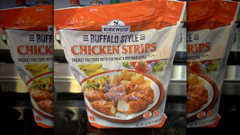A bag of Kirkwood Buffalo Style Chicken Strips from Aldi on kitchen oven.