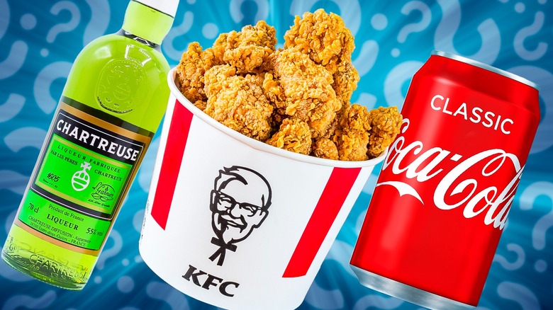 A bottle of Chartreuse, a KFC bucket, and a can of Coca-Cola