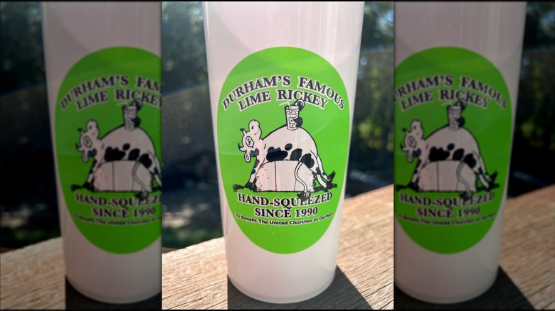 A green and white collectible cup of Durham's Famous Lime Rickey.