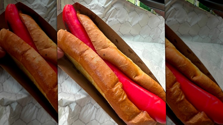 Bright red Maine Red Snapper hot dog in classic lobster roll bun.