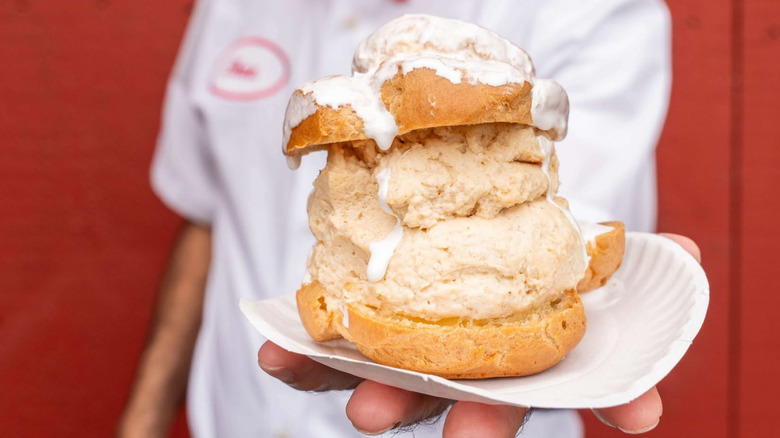 A huge Big E Cream Puff with peanut butter filling and marshmallow fluff topping.