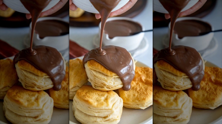 biscuits with chocolate gravy being poured over them