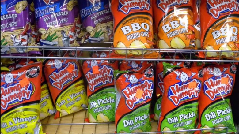 Grocery shelves lined with various flavors of Humpty Dumpty potato chips