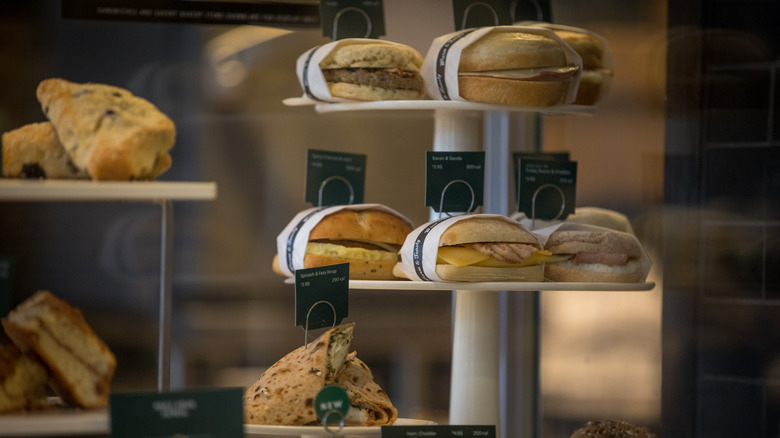 Various breakfast sandwiches in display case at Starbucks