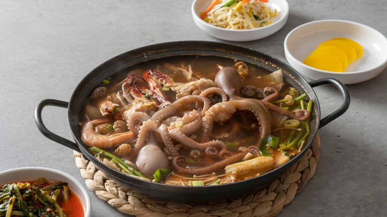 Live octopus soup in a dish