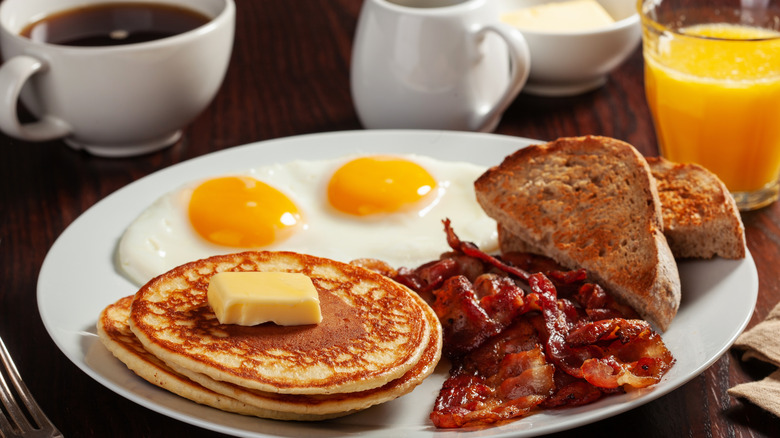 pancakes, toast, coffee, and bacon for breakfast