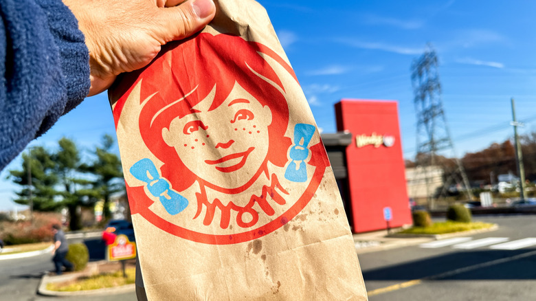Wendy's bag with restaurant in the background