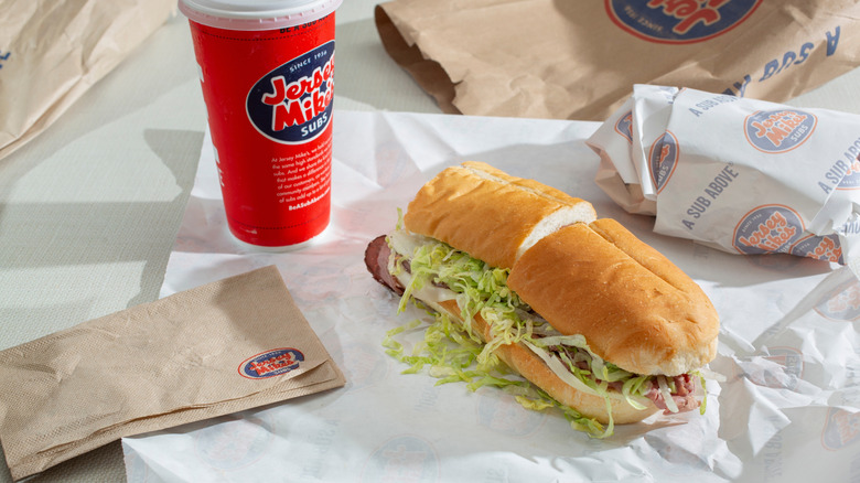 jersey mikes sub with drink on table