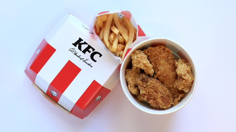 kfc fries and chicken on white surface