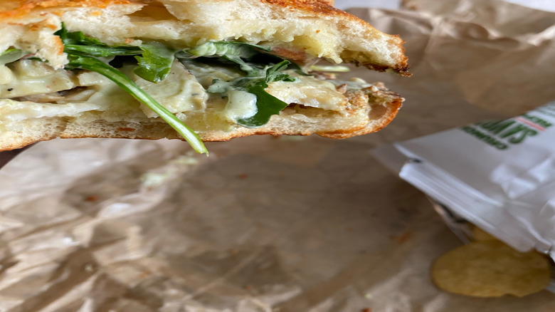 half-eaten panera bread sandwich