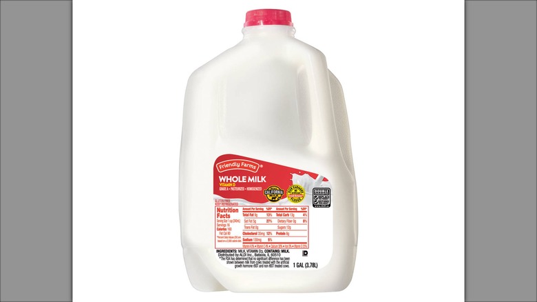 gallon of Friendly Farms whole milk with red cap and label