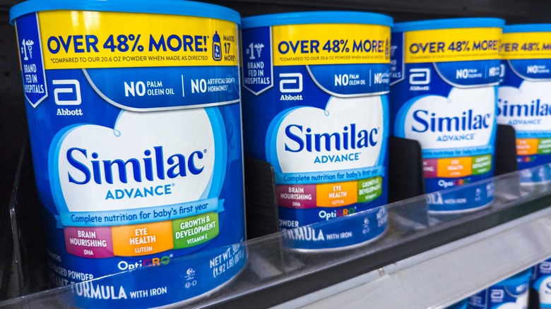 Similac Advance Baby Formula cans on Walmart store shelf