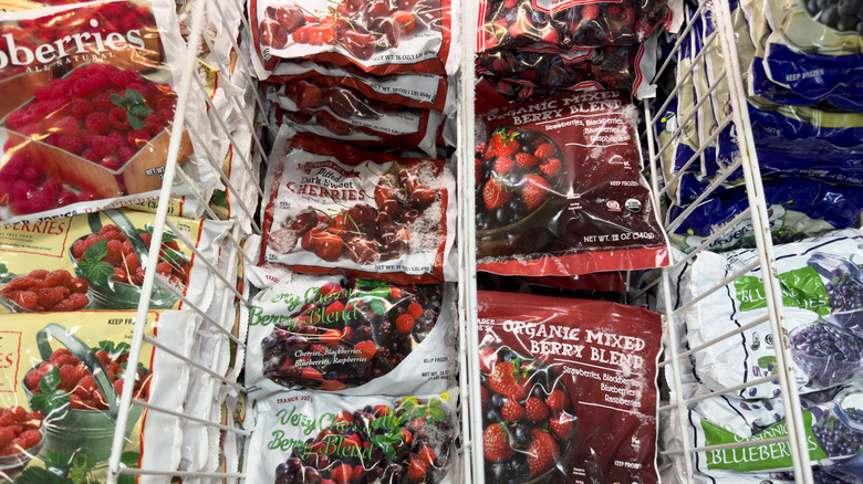 Bags of frozen berries stocked in the freezer at Trader Joe's