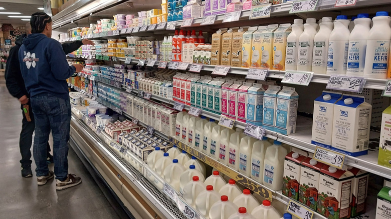 Two men browse milk aisle at Trader Joe's