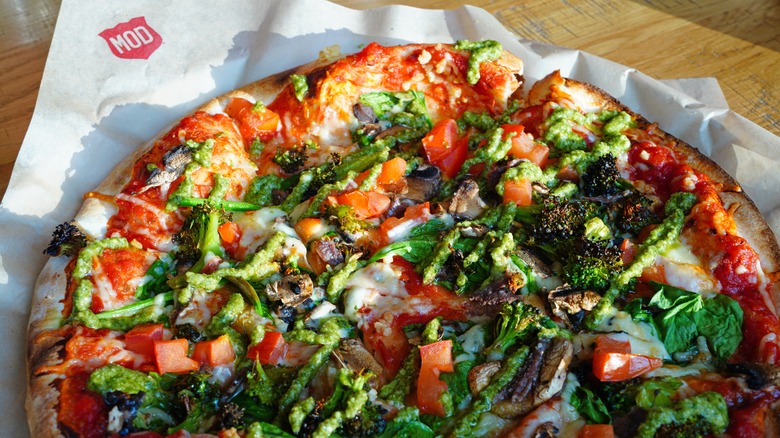Mod pizza on table in restaurant