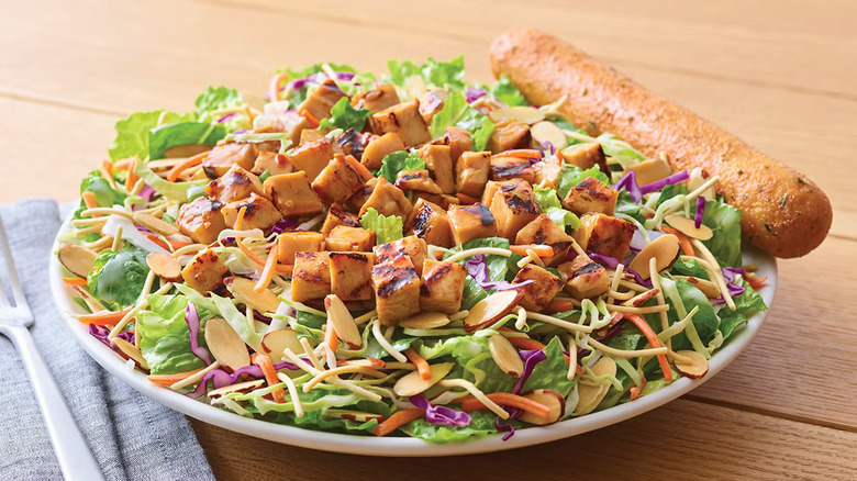 Oriental Chicken Salad with bread and utensils