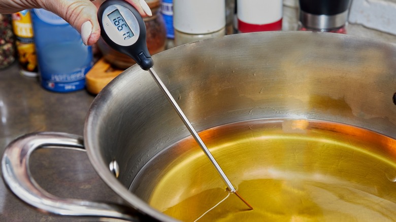 Digital thermometer in pot of oil