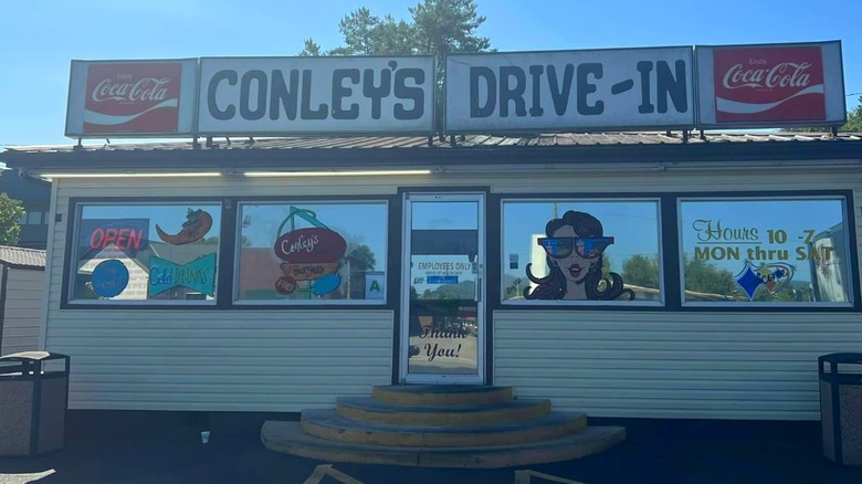 Exterior of Conley's Drive-In Restaurant with Coca-Cola signs and reflected windows