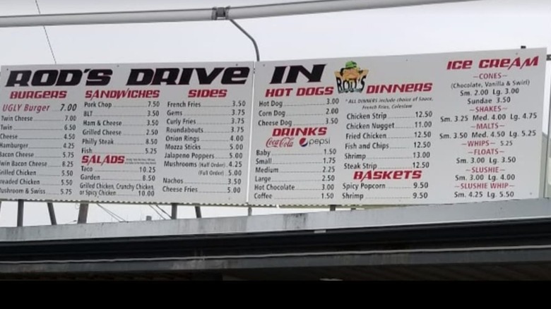 Rod's Drive In Menu Board posted above restaurant listing burgers, sandwiches, and shakes
