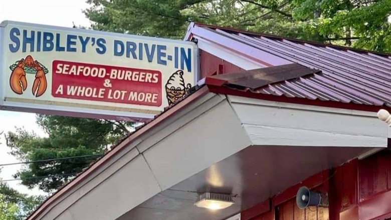 Exterior of Shibley's drive-in with sign that has a Lobster and ice cream cone