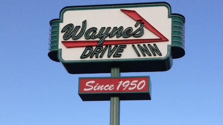 Wayne's Drive Inn retro sign against blue sky