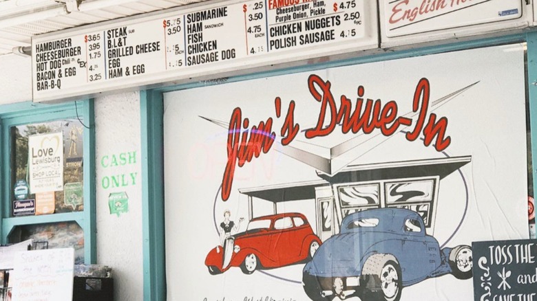 Close up of front exterior with menu order board featuring old fashioned vintage cars